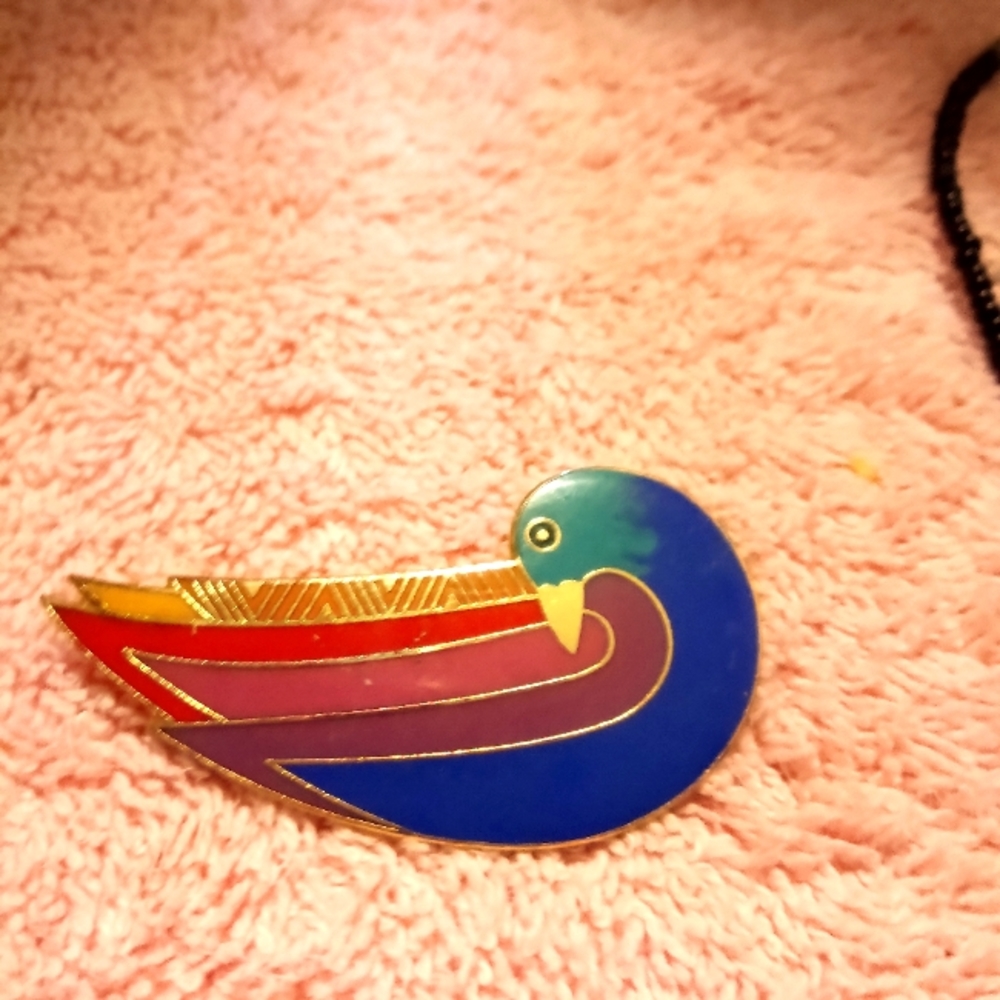 Laura Burch pin. She is no longer with us but her work remains